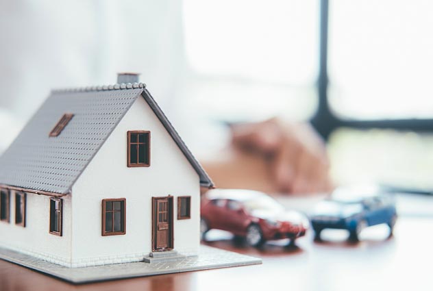 miniature house with cars | Luis Guerra Personal Injury Trial Attorneys | Phoenix, Arizona