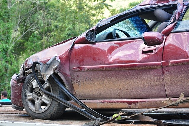 red car in an accident | Luis Guerra Personal Injury Trial Attorneys | Phoenix, Arizona