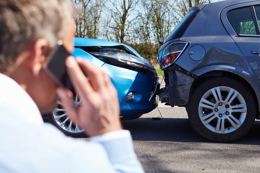 man on the phone calling help for a car accident | Luis Guerra Personal Injury Trial Attorneys | Phoenix, Arizona